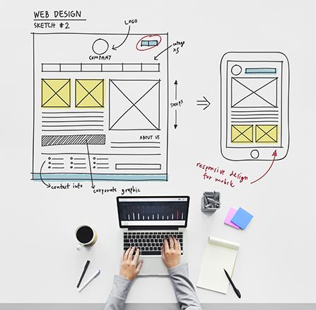 Person on computer drafting wireframe mockups